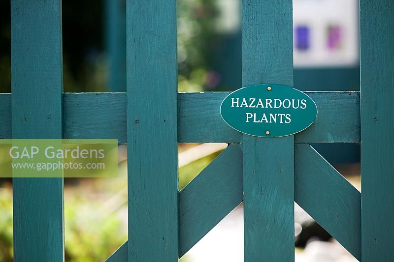 Hazardous plants sign on a gate at RHS Wisley gardens