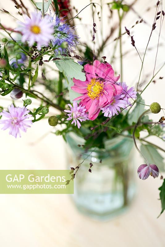 Garden bouquet with Anemone 'Pamina', Asters, Caryopteris and Panicum