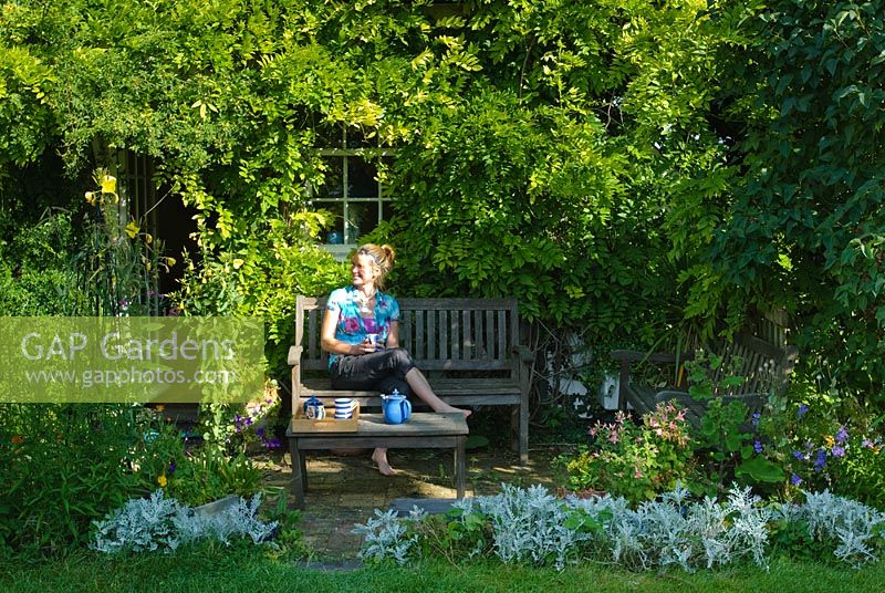 Joy Martin relaxing in her garden - Wild Rose Cottage, Lode, Cambridge