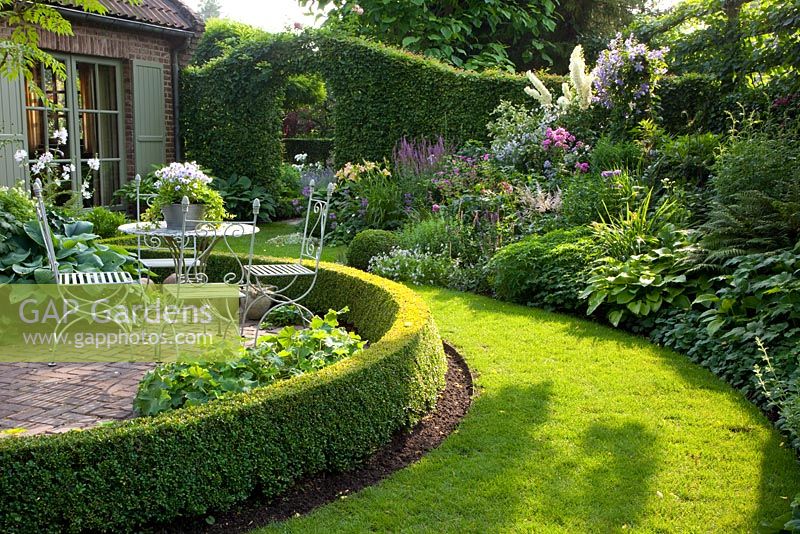 Terrace with seating area in cottage garden