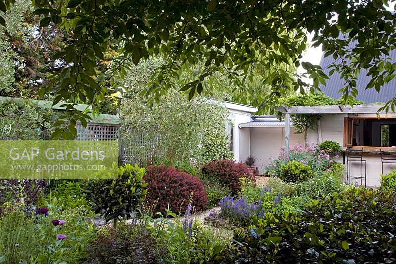 View of house and herbaceous flowerbeds - Breedenbroek, New Zealand