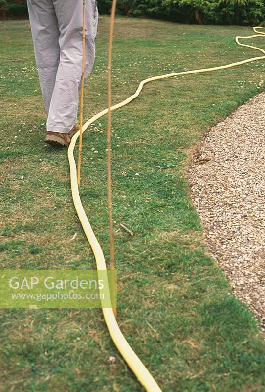 How to mark out your plot.  A brightly-coloured hosepipe is ideal for using as a guide to mark the boundary of a bed or border - or to mark the edges and route of a new path.