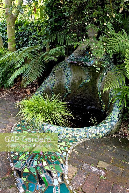 Gaudi inspired, mosaic tiled water feature in shaded area, planted with ferns and grasses. No. 11, Christchurch, New Zealand