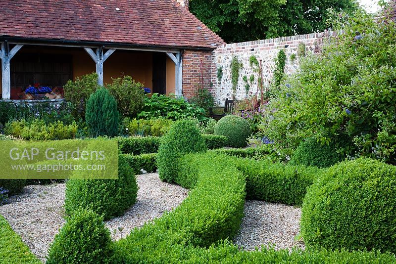 Formal topiary garden to verandah - Rymans, Sussex