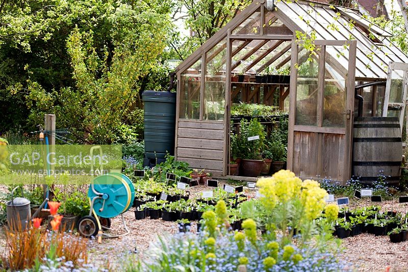 Wooden greenhouse in working area. Brickwall Cottages, Frittenden, Kent