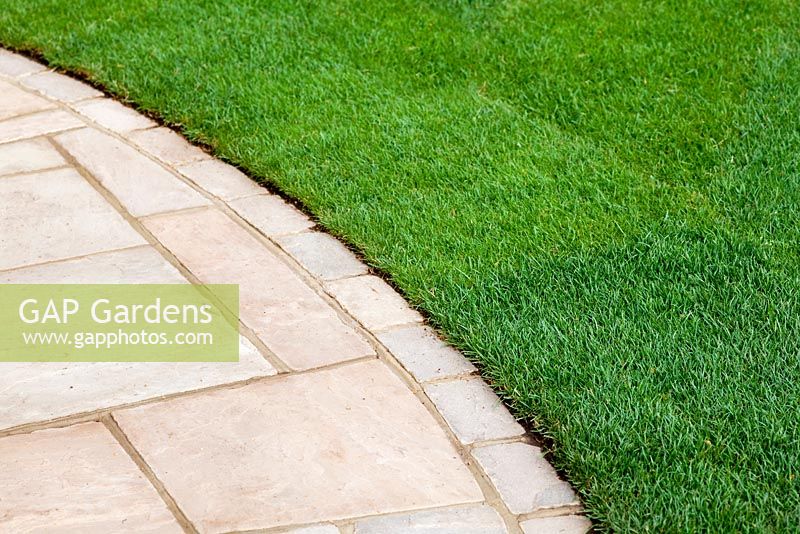 Curved flagstone path next to lawn in The Urban Retreat - RHS Hampton Court 2010 