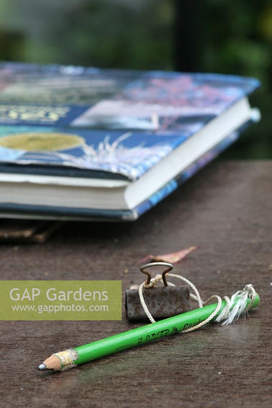 Pencil and reference book. Nursery and garden in The Netherlands.