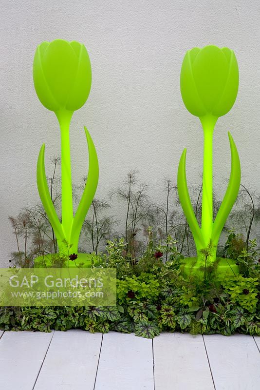 Neon flower shaped ornaments. Chic Tranquillity garden - RHS Tatton Park 2010