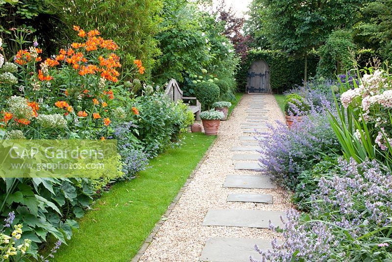Summer borders with plants including Nepeta - Catmint and Alstroemeria