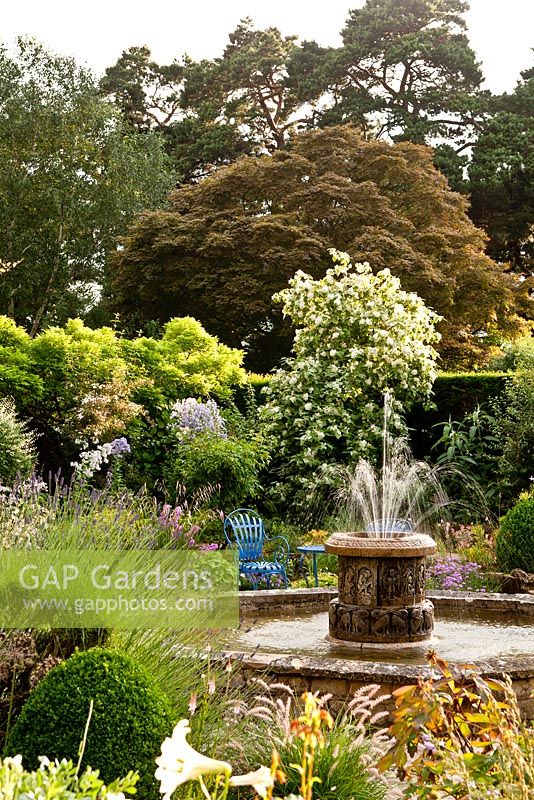 Sunken garden with water fountain - Kiftsgate Court Garden, Chipping Campden, Gloucestershire, UK