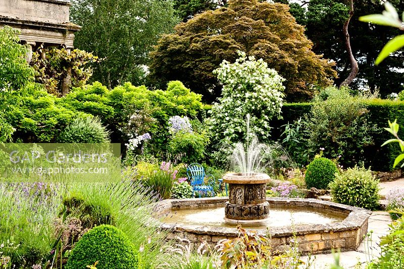 Sunken garden with water feature - Kiftsgate Court Garden, Chipping Campden, Gloucestershire, UK