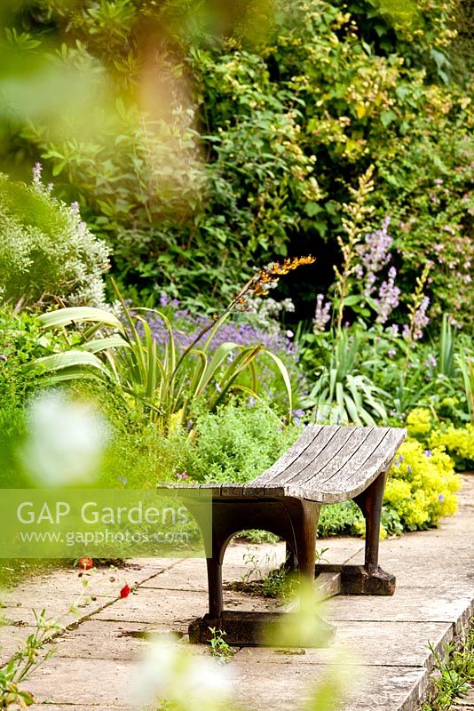 Bench in Lower garden - Kiftsgate Court Garden, Chipping Campden, Gloucestershire, UK