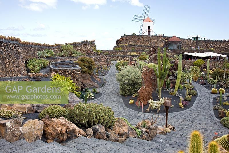 The restored windmill, with the covered restaurant below - El Jardin de Cactus, Lanzarote, Canary Islands