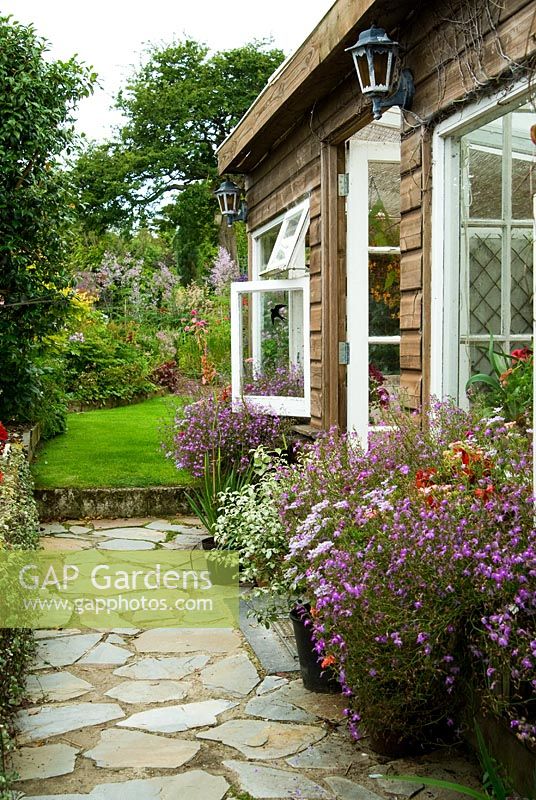 Summerhouse. Poppy Cottage Garden, Roseland Peninsula, Cornwall, UK