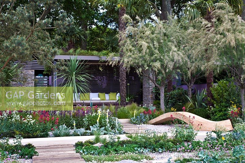 Seating area, pavilion and borders of maritime plants - The Cancer Research UK Garden, Silver Gilt Medal Winner, RHS Chelsea Flower Show 2011 
