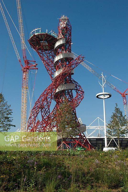 Olympic Park Sculpture by Anish Kapoor - the Arcelor Mittal Orbit, nicknamed the Helter-Skelter and the Hubble Bubble with giant cranes and North American Prairie planting. 