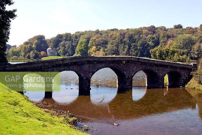 The Palladian Bridge and view to the Pantheon at Stourhead Gardens, Wiltshire, UK, early September, designed by Henry Hoare