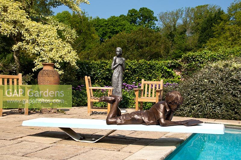 The poolside terrace, pashley manor gardens, sculpture by kate denton