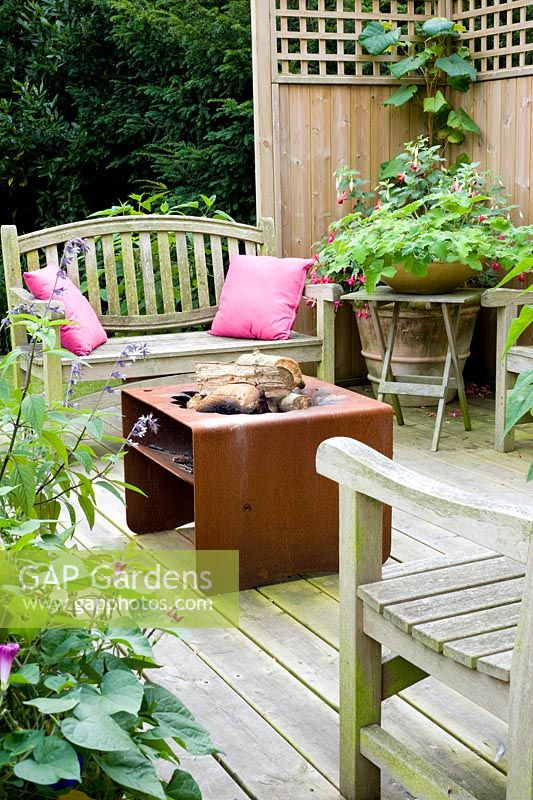 Deck with fire basket, seating and containers - Woodpeckers, Essex NGS