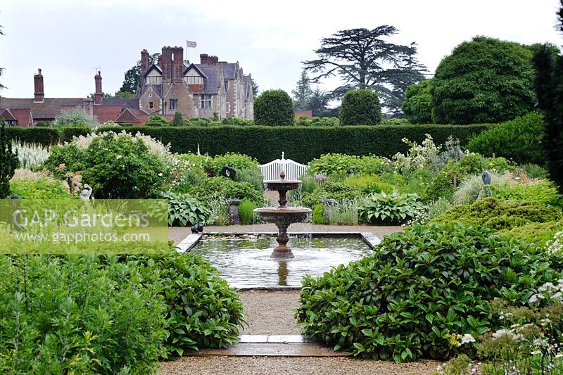 Rectangular pond with fountain, The White Garden, Loseley Park, Surrey.