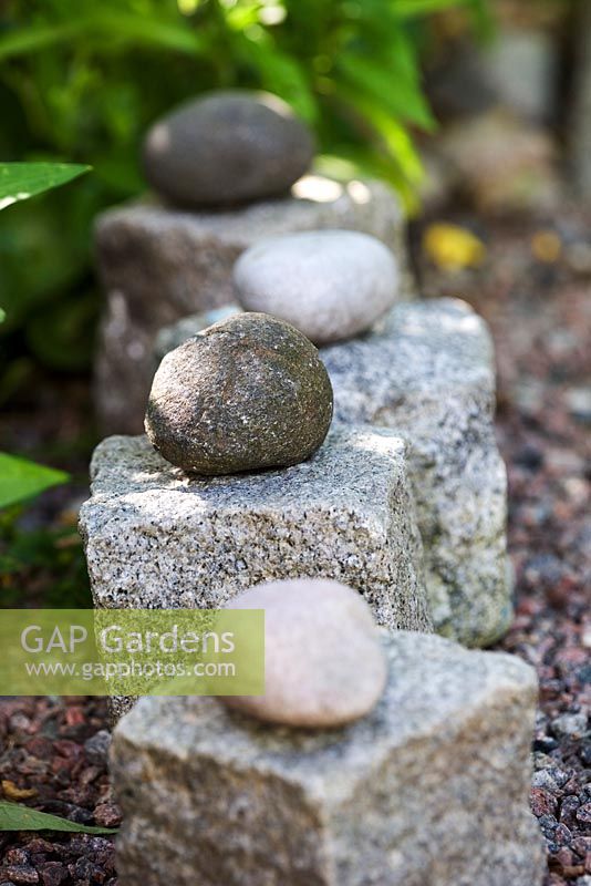 Cobble stones and pebbles on gravel path
