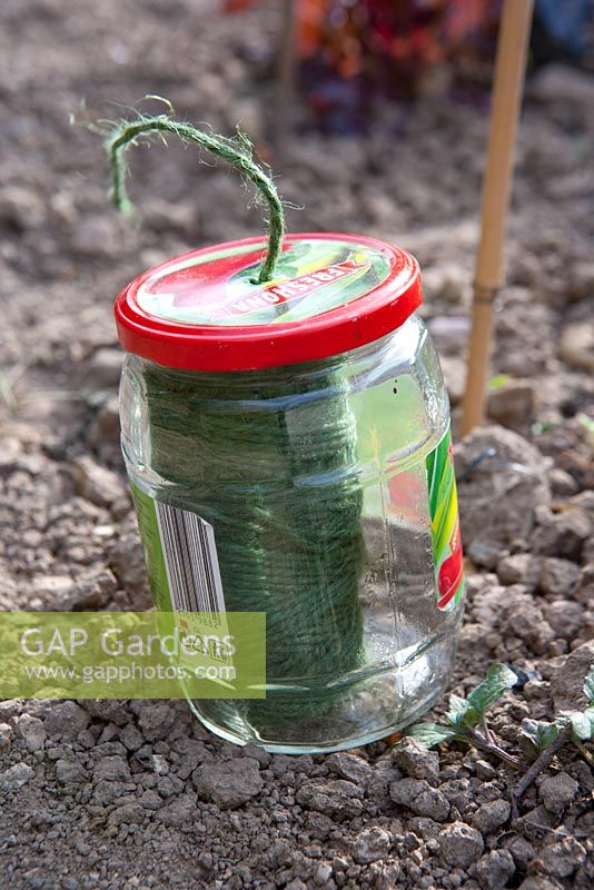 A useful way of keeping gardener's string from getting knotted up is to keep it in a glass jar