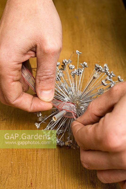 Making homemade Christmas tree decorations with sprayed seedheads