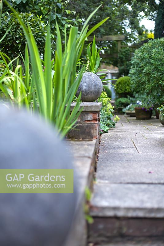 Path at top of steps with ball finials