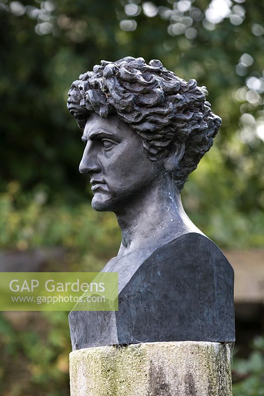 A bust of Leon Krier, the master architect, of The King's Poundbury development in Dorset. Highgrove Garden. August 2007. 