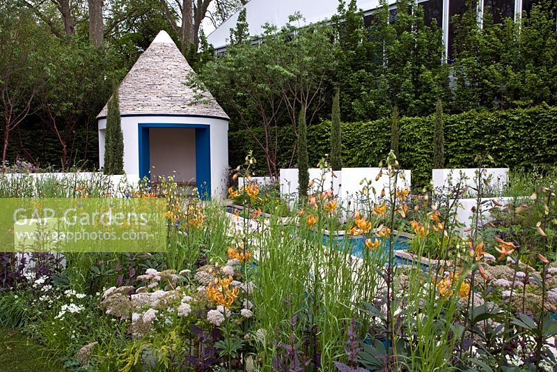 The RBC Blue Water Garden. Linear rills and canals reminiscent of the Alhambra in Spain. A trulli building with conical drystone roof. 