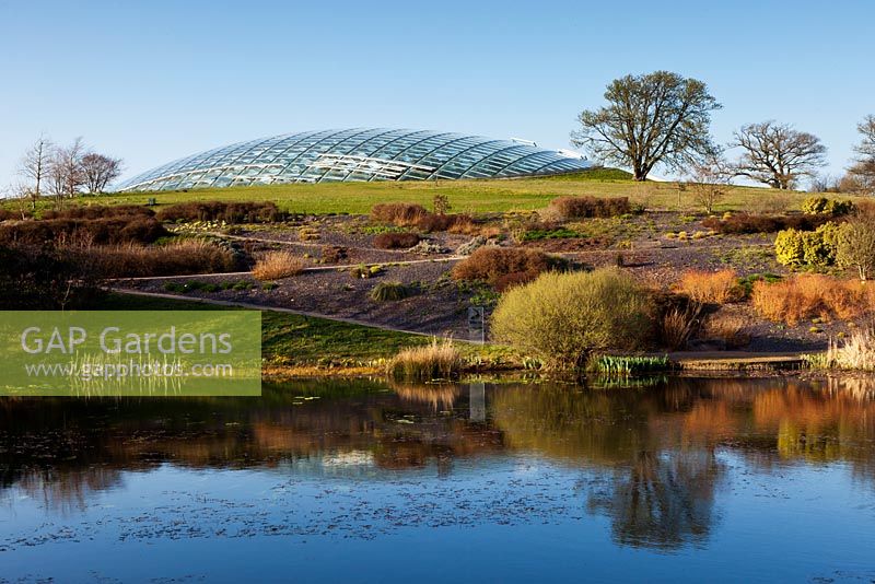 View across Llyn Uchaf to the Great Glasshouse by Sir Norman Foster. National Botanic Garden of Wales, March 2012. 