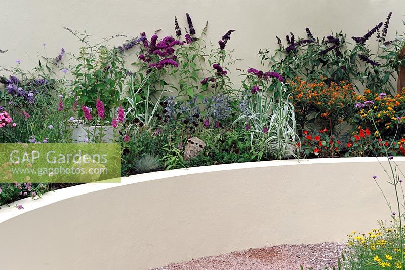 Raised bed with planting to attract butterflies. Butterfly Jungles garden. Hampton Court Palace Flower show 2012 