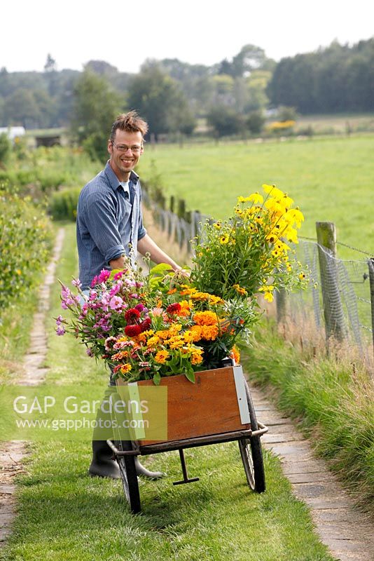 Martin Heutink with a trolley of organic flowers for his clients at nursery Bloemrijk