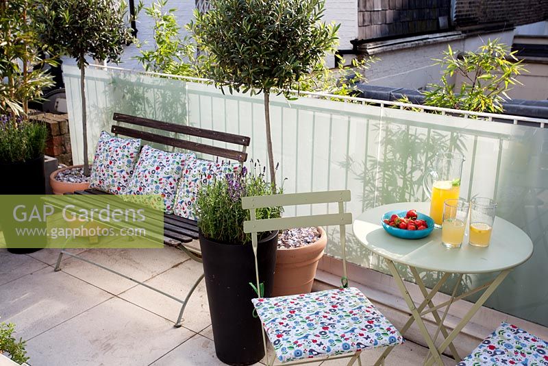 Small London garden with table and drinks
