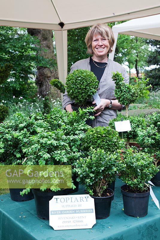 The Garden Museum. Jenny Alban Davies of River Garden Topiary on her stall at the plant fair.