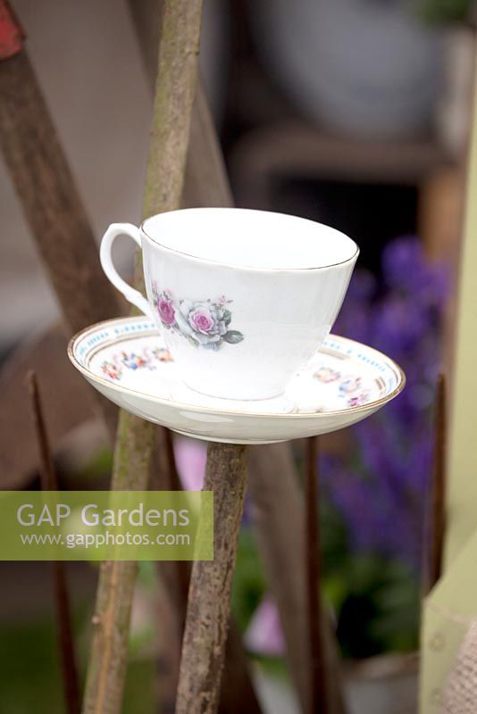 Teacups on sticks filled with birdseeds. Preserving the Community - Silver medal winner - RHS Hampton Court Flower Show 2012.