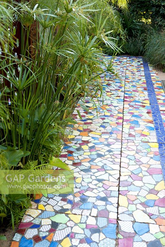 International Garden Festival 2012 Domaine de Chaumont-sur-Loire. Theme - GARDENS OF DELIGHT, GARDENS OF DELIRIUM. Title - Locus Genii. Floor of broken colourful tiles.