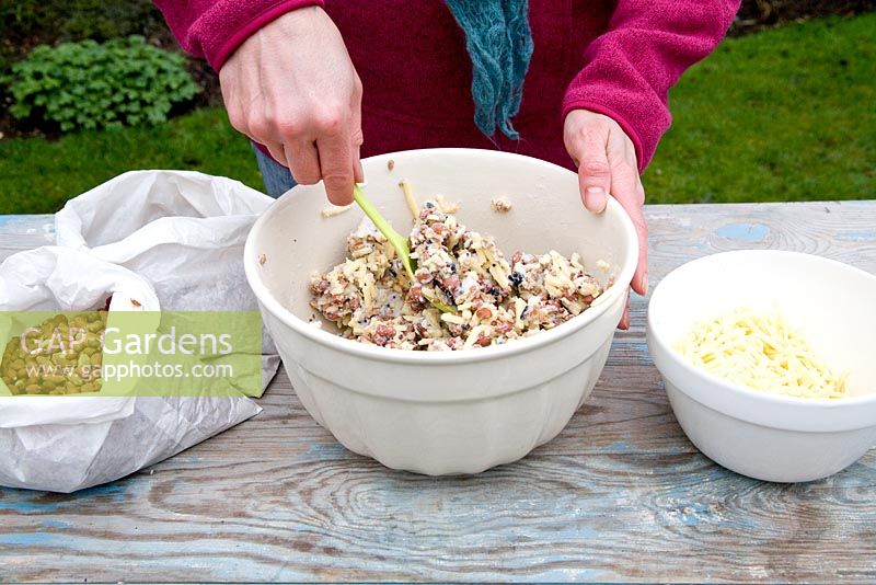 Step by step for creating hanging bird feeders out of teacups and yoghurt pots - stirring mixture 