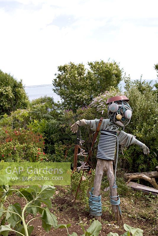 Scarecrow made from recycled coastal objects - Coastal allotment, Mousehole, Cornwall