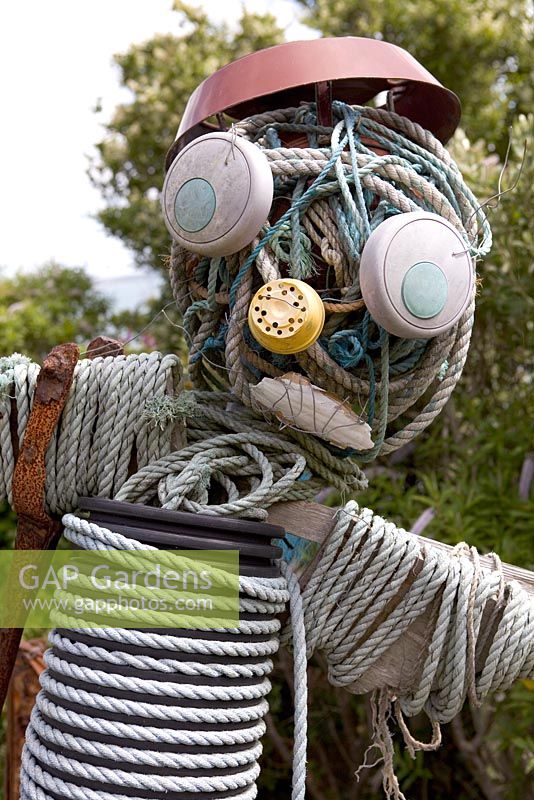 Scarecrow made from recycled coastal objects - Coastal allotment, Mousehole, Cornwall