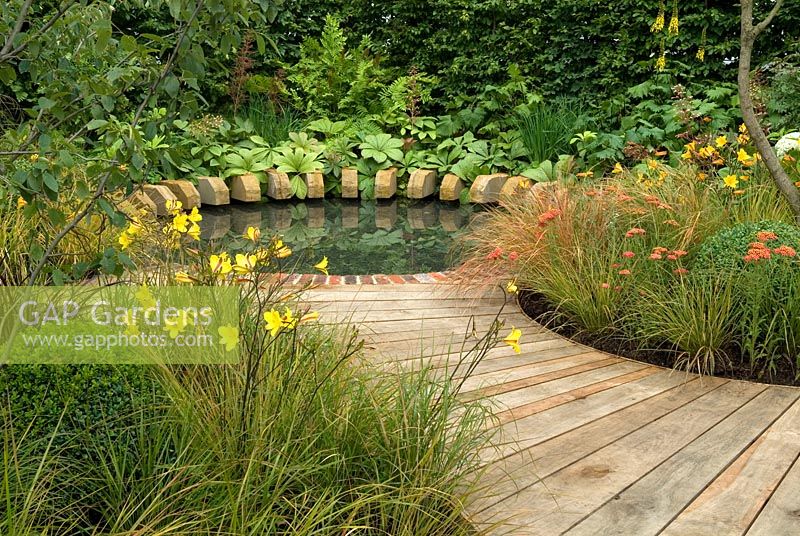 Boardwalk to pool with sculptured edging - RHS Hampton Court Flower Show 2007