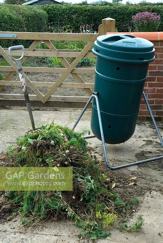 Garden waste alongside rotary composting bin - Field Dalling, Norfolk