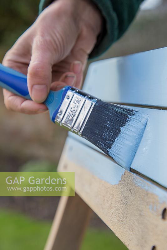 Painting freshly sanded seat with Pastel Blue paint