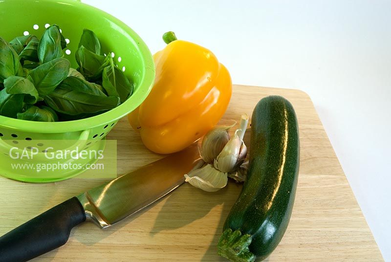Fresh vegetables and Basil leaves in colander
