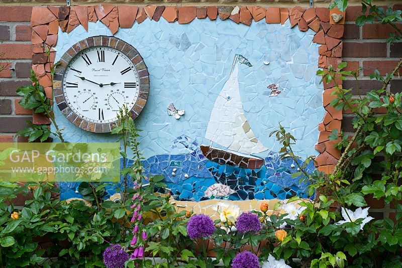 Home made nautical themed garden frieze incorporating a weather station