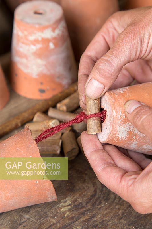 Step by step -  Making a decoration from small terracotta pots to hang inside hazel wigwam