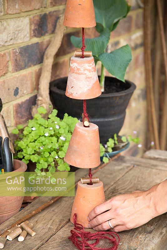 Step by step -  Making a decoration from small terracotta pots to hang inside hazel wigwam