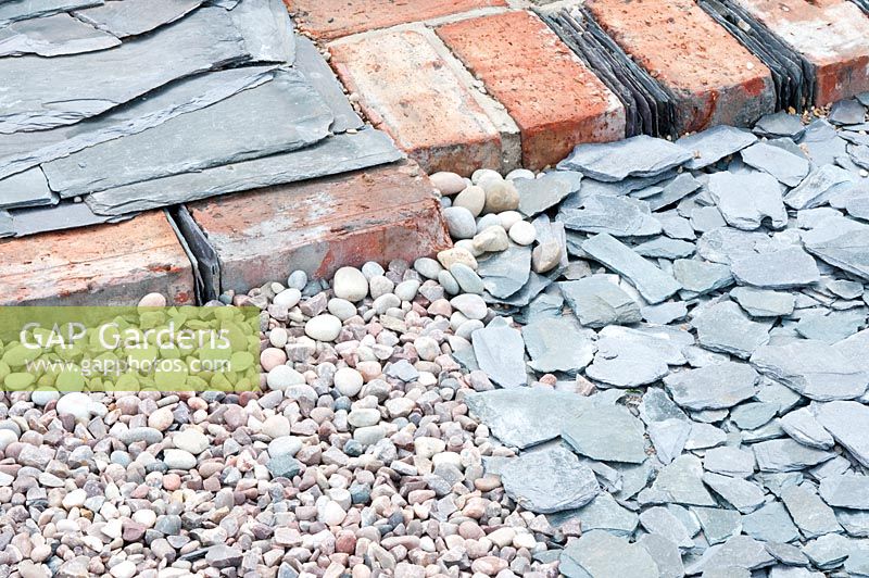 Detail of path made of assorted stone, old bricks and roofing slate