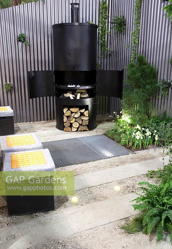 Outside wood burner and storage on small modern terrace