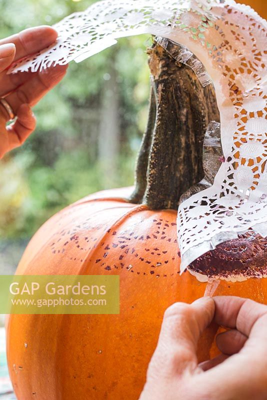 Removing stencil from the Pumpkin to reveal pattern